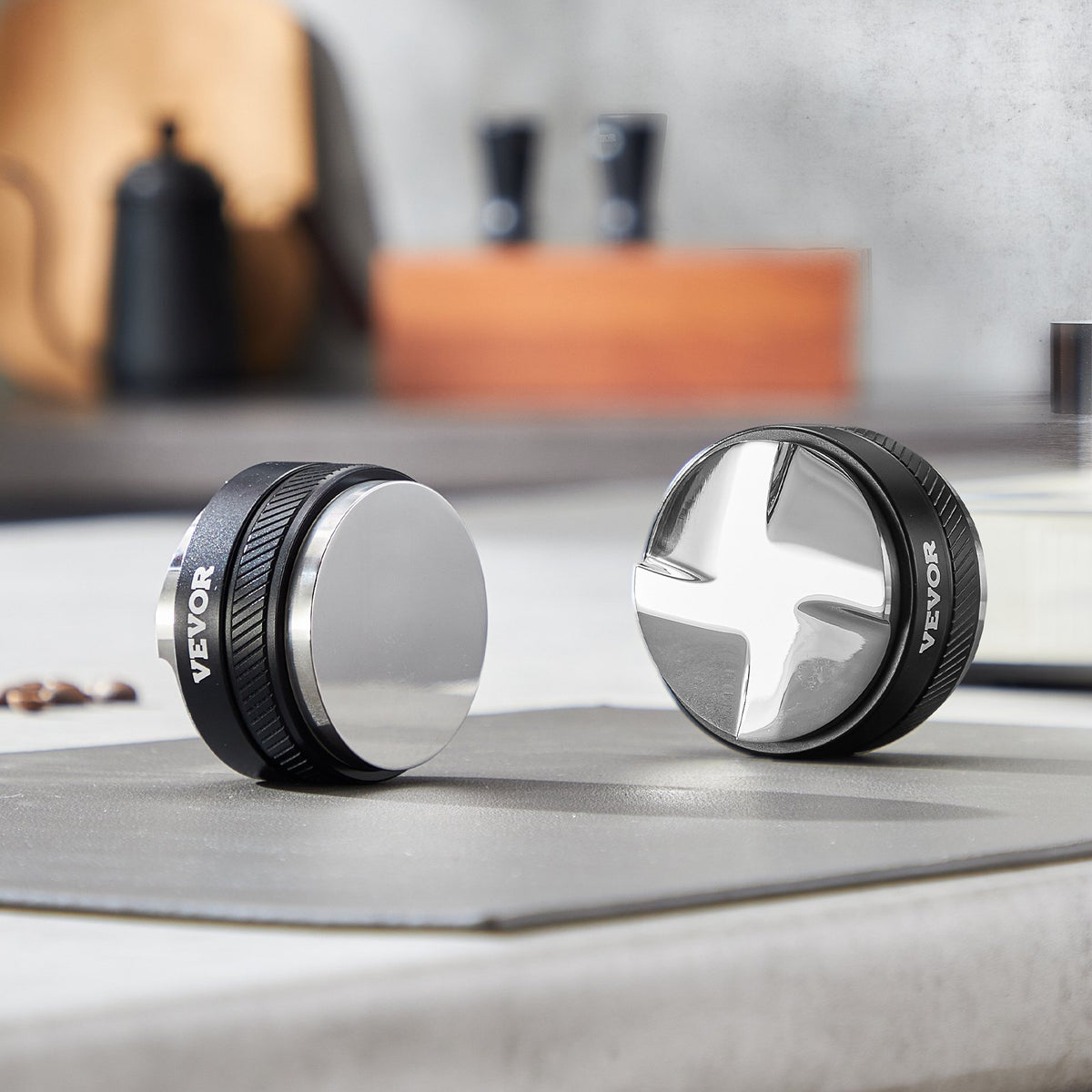 53mm espresso distributor and tamper on counter